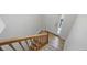 Clean entryway with staircase features tile floor by door, leading to carpeted stairs at 1111 Cavendish Dr, Carmel, IN 46032