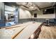 Elegant game room showcasing a full-sized pool table, ambient lighting, and comfortable seating at 1111 Cavendish Dr, Carmel, IN 46032