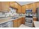 Modern kitchen with stainless steel appliances and ample counter space at 1111 Cavendish Dr, Carmel, IN 46032