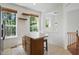 Bright eat-in kitchen with an island, shelving, and natural light from multiple windows offering pleasant backyard views at 1111 Cavendish Dr, Carmel, IN 46032