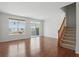 Bright living room featuring hardwood floors, large windows, and sliding door to the outside at 1111 Cavendish Dr, Carmel, IN 46032