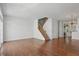 Open living area with hardwood floors, natural light, and a staircase to the upper level at 1111 Cavendish Dr, Carmel, IN 46032