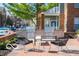 Outdoor patio featuring built-in grills, seating areas, and lush landscaping at 1111 Cavendish Dr, Carmel, IN 46032