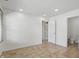 Clean room featuring tile floors and white walls adjacent to a half bathroom at 1111 Cavendish Dr, Carmel, IN 46032
