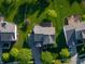 Overhead view of a home with landscaped yard, deck area, mature trees, and neighborhood surroundings at 11727 Wedgeport Ln, Fishers, IN 46037