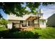 Back exterior with deck, pergola and spacious lawn at 11727 Wedgeport Ln, Fishers, IN 46037