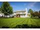 Back exterior featuring a lawn, back porch with pergola, and siding at 11727 Wedgeport Ln, Fishers, IN 46037