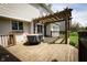 Back deck with hot tub, pergola and sliding glass doors at 11727 Wedgeport Ln, Fishers, IN 46037