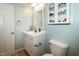 Bathroom boasts a vanity, mirror, and toilet in a clean and well-maintained space at 11727 Wedgeport Ln, Fishers, IN 46037