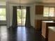 Dining area featuring sliding glass doors to the deck and dark hardwood floors at 11727 Wedgeport Ln, Fishers, IN 46037