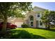 Attractive home exterior with a well-maintained lawn, tree, and a two-car garage at 11727 Wedgeport Ln, Fishers, IN 46037