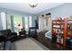 Comfortable living room with a bay window, dark floors, and a cozy seating area at 11727 Wedgeport Ln, Fishers, IN 46037