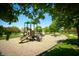 Community playground featuring slides, swings, and climbing structures at 11727 Wedgeport Ln, Fishers, IN 46037