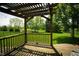 Back porch with a pergola and view of the lawn at 11727 Wedgeport Ln, Fishers, IN 46037