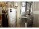 Functional utility room with water heater, furnace, and essential systems for the home at 11727 Wedgeport Ln, Fishers, IN 46037