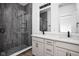 Stylish bathroom featuring double sinks, a walk-in shower and modern fixtures at 1216 N Alabama St, Indianapolis, IN 46202