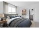 Cozy bedroom with a large window, ensuite bathroom, and a comfortable bed at 1216 N Alabama St, Indianapolis, IN 46202