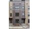 Newly constructed townhome with brick facade and multiple windows, awaiting final landscaping at 1216 N Alabama St, Indianapolis, IN 46202