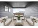 Outdoor seating area with comfortable chairs, a coffee table, and a covered roof at 1216 N Alabama St, Indianapolis, IN 46202