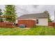 Well-maintained backyard featuring a wooden deck, privacy fence, and lush green lawn at 12328 Slate Dr, Fishers, IN 46037