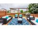 Inviting outdoor deck featuring stylish patio furniture, an eye-catching blue rug, and a built-in grill area at 12328 Slate Dr, Fishers, IN 46037