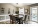 Dining area with table, chairs, wine rack, and access to a patio at 12328 Slate Dr, Fishers, IN 46037