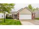 Lovely one-story home with attached two-car garage and well-maintained lawn at 12328 Slate Dr, Fishers, IN 46037