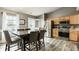 Bright eat-in kitchen with stainless appliances, wooden cabinets, and view of the backyard at 12328 Slate Dr, Fishers, IN 46037