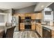 Bright eat-in kitchen with stainless appliances and light wood cabinets at 12328 Slate Dr, Fishers, IN 46037