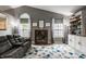 Bright living room with vaulted ceilings, decorative shelving, and comfortable seating arrangement at 12328 Slate Dr, Fishers, IN 46037