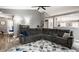 Open-concept living room with a spacious gray sectional sofa and stylish decor at 12328 Slate Dr, Fishers, IN 46037