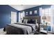 Comfortable main bedroom featuring a large upholstered headboard and plenty of natural light at 12328 Slate Dr, Fishers, IN 46037