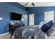 Comfortable main bedroom featuring dark blue accent wall and modern furniture at 12328 Slate Dr, Fishers, IN 46037