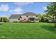 Sprawling backyard with a wood deck, screened in porch, trampoline and mature trees at 13868 Broad Mdw, Carmel, IN 46032