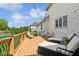 Relaxing backyard deck space with patio seating, string lights and beautiful wrought iron railing at 13868 Broad Mdw, Carmel, IN 46032