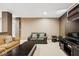 Finished basement offering a cozy seating area with a sofa, media console and entertainment center at 13868 Broad Mdw, Carmel, IN 46032