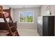 Bedroom with bunk beds, a window view to the neighborhood, and dark stained furniture at 13868 Broad Mdw, Carmel, IN 46032
