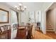 Elegant dining room showcasing a chandelier, hardwood floors, and classic furnishings at 13868 Broad Mdw, Carmel, IN 46032