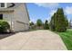 Long driveway leading to a three car garage and basketball hoop at 13868 Broad Mdw, Carmel, IN 46032