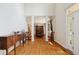 Grand foyer with hardwood floors, soaring ceilings, and elegant architectural details at 13868 Broad Mdw, Carmel, IN 46032