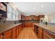 Well-equipped kitchen with granite countertops, abundant cabinetry, and modern stainless steel appliances at 13868 Broad Mdw, Carmel, IN 46032