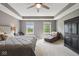 Relaxing main bedroom featuring tray ceilings, neutral paint, and large windows at 13868 Broad Mdw, Carmel, IN 46032