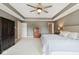 Serene main bedroom suite with tray ceiling and an ensuite bathroom at 13868 Broad Mdw, Carmel, IN 46032