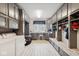 Well-organized mudroom with custom cabinets, bench seating, and ample storage solutions at 13868 Broad Mdw, Carmel, IN 46032