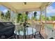 Relaxing porch with a glass table, grill, heater and a beautiful view of the backyard at 13868 Broad Mdw, Carmel, IN 46032