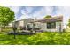 Manicured backyard features a patio with outdoor furniture, lush grass, and a flowerbed at 14291 Holly Berry Cir, Fishers, IN 46038