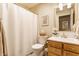 Bathroom features white tiling, a modern vanity, and a bathtub with shower, offering a clean design at 14291 Holly Berry Cir, Fishers, IN 46038
