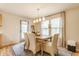 Charming dining room with natural light, a wooden table, and elegant chairs at 14291 Holly Berry Cir, Fishers, IN 46038