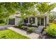Charming home featuring a well-manicured lawn, cozy seating area, and inviting entrance at 14291 Holly Berry Cir, Fishers, IN 46038
