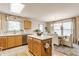 Functional kitchen showcasing wood cabinets, stainless steel appliances, and an open view into the dining area at 14291 Holly Berry Cir, Fishers, IN 46038